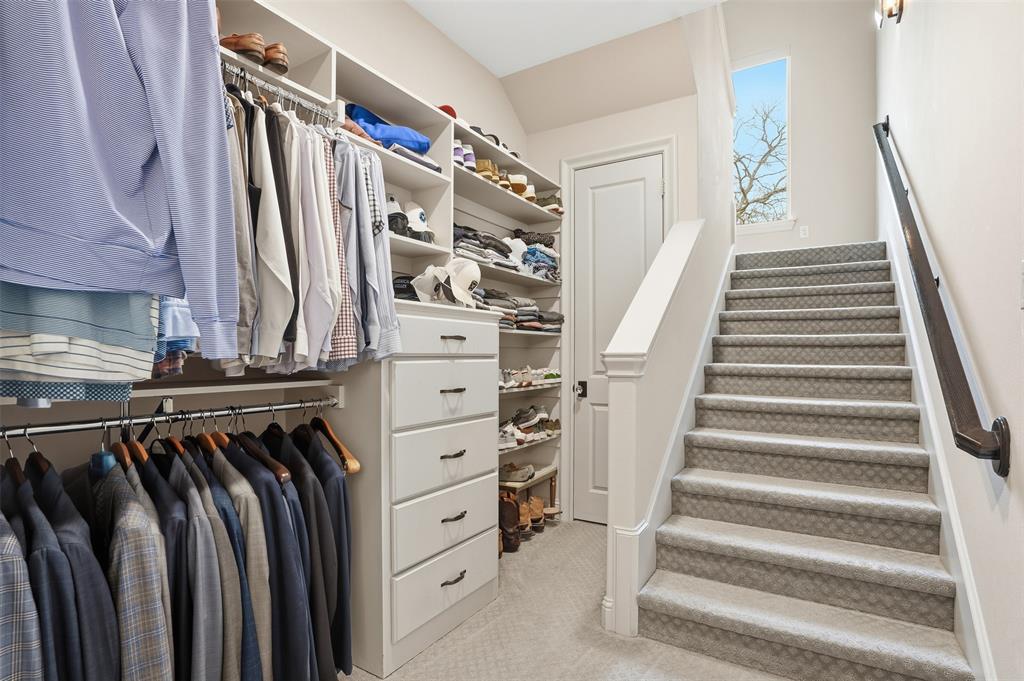 6714 Williamson Road Dallas, TX 75214 - Photo 23 of 40 a view of walk in closet with clothes and shoes