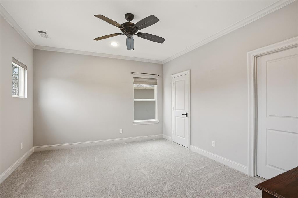 6714 Williamson Road Dallas, TX 75214 - Photo 26 of 40 an empty room with a ceiling fan and windows