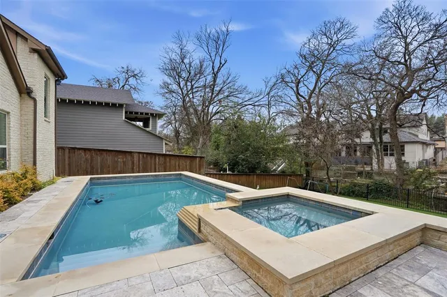 a view of a mini pool with a yard