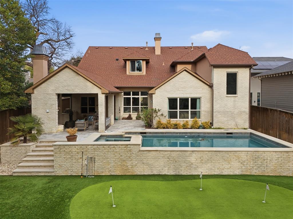 6714 Williamson Road Dallas, TX 75214 - Photo 36 of 40 a front view of a house with a garden and yard