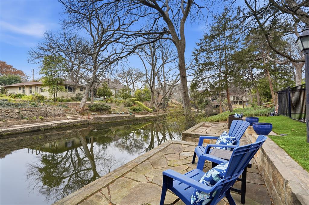 6714 Williamson Road Dallas, TX 75214 - Photo 38 of 40 a view of a lake with couches and wooden fence