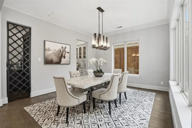 a view of a dining room with furniture and window