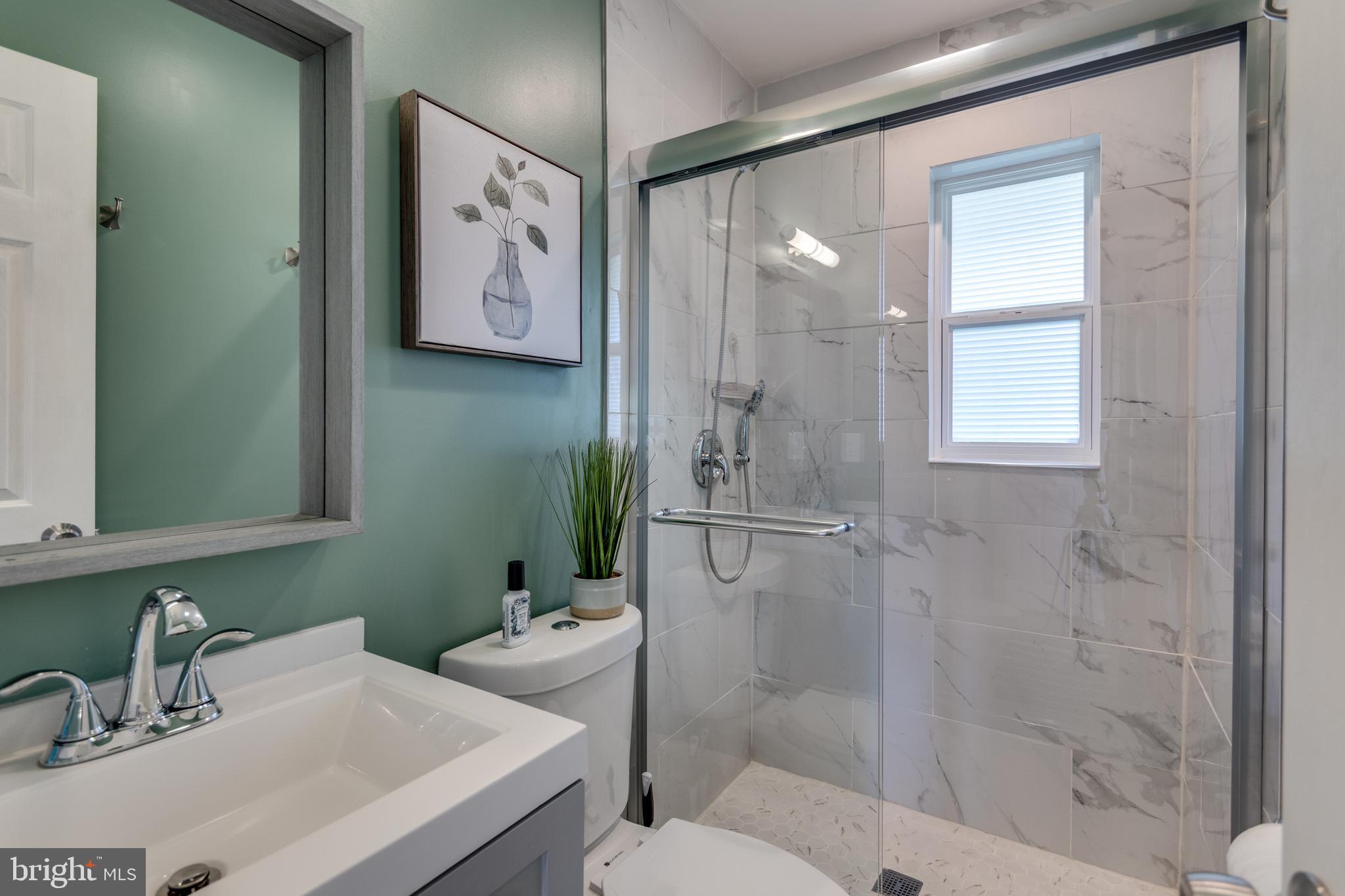 7431 Axton Street Springfield, VA 22151 - Photo 16 of 23 a bathroom with a sink and a mirror