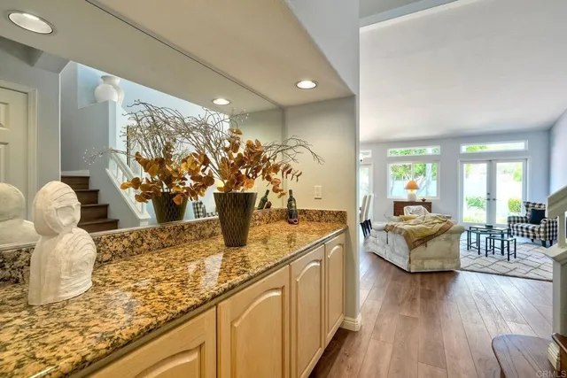a view of a kitchen with a sink hardwood and a ceiling fan