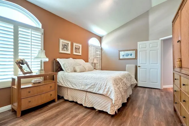 a bed room with a bed and a window