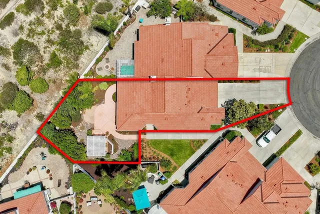 a building outdoor space with patio furniture and potted plants