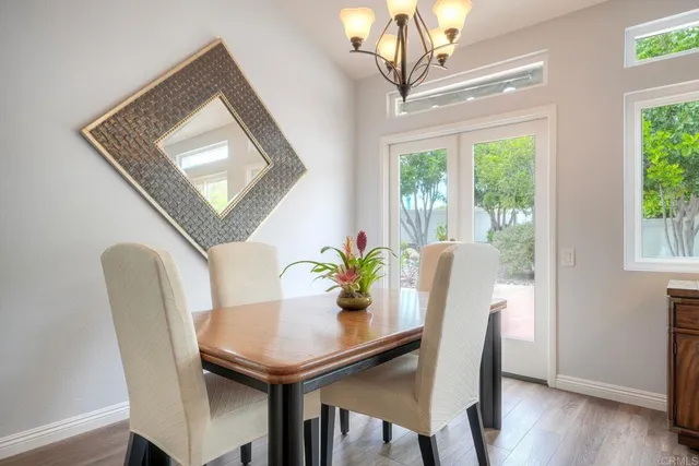a kitchen with sink and mirror