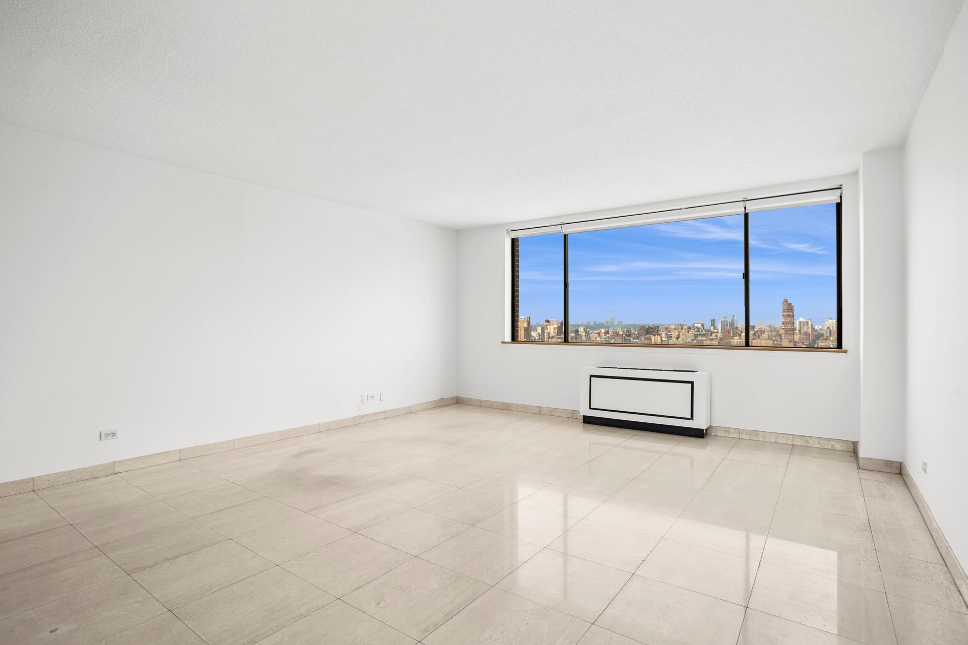 45 West 67th Street, Unit 28F Manhattan, NY 10023 - Photo 3 of 9 a view of a room with furniture and window