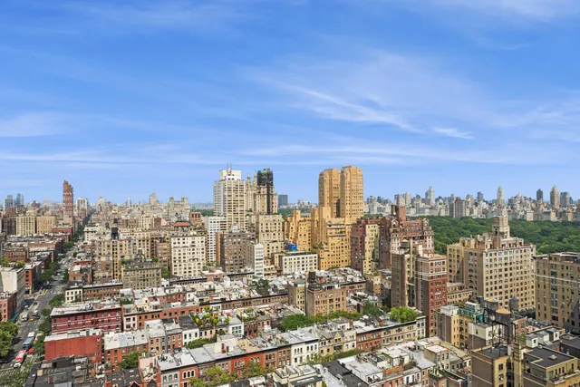 a view of a city with tall buildings in the background