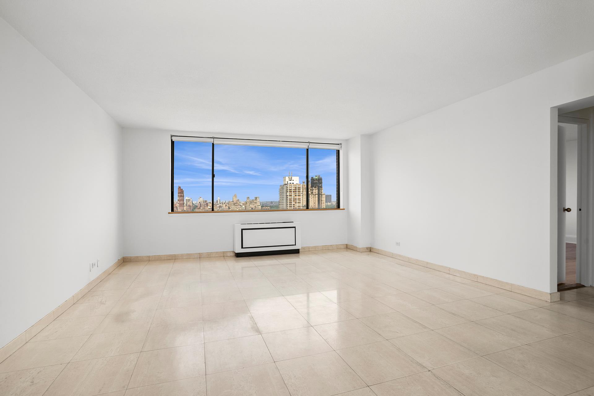 45 West 67th Street, Unit 28F Manhattan, NY 10023 - Photo 6 of 9 a view of an empty room with a window