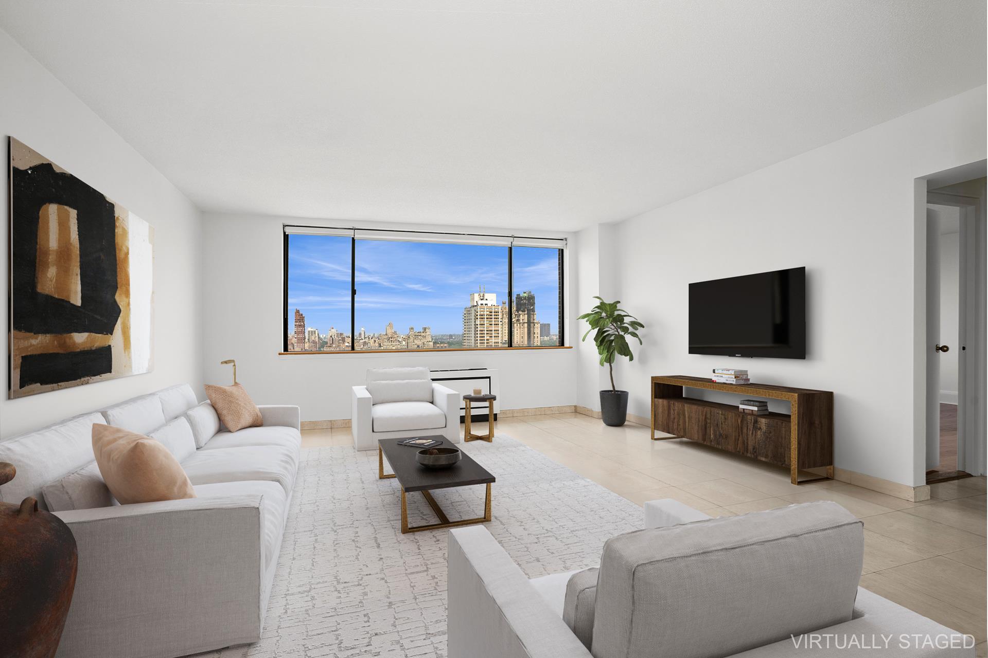 45 West 67th Street, Unit 28F Manhattan, NY 10023 - Photo 7 of 9 a living room with furniture a flat screen tv and a window
