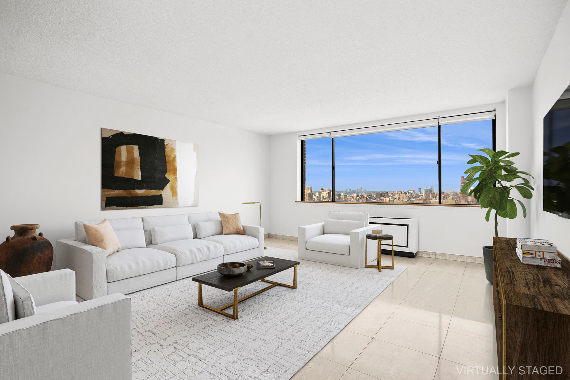 45 West 67th Street, Unit 28F Manhattan, NY 10023 - Photo 8 of 9 a living room with furniture and a potted plant