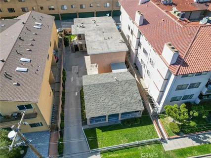 an aerial view of a house with a yard