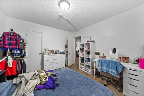 a bedroom with a bed and a closet