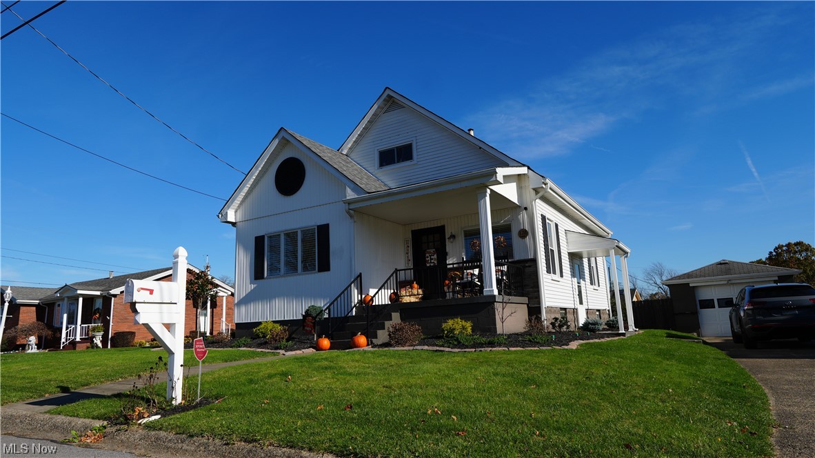 174 Powers Road Weirton, WV 26062 - Photo 1 of 33 View of front of home with a front yard and covered porch