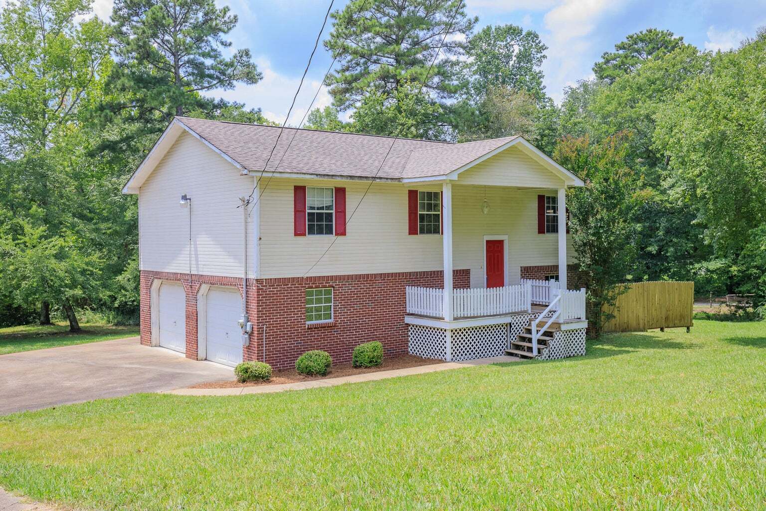 47 Lisbon Road Chickamauga, GA 30707 - Photo 1 of 1 a front view of house with yard and trees in the background