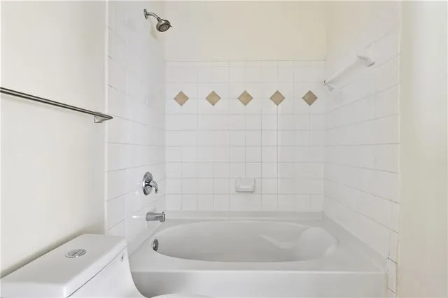 a close up of a bathtub in a bathroom