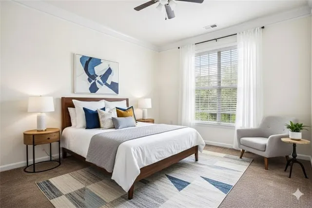 a bedroom with a bed and a couch