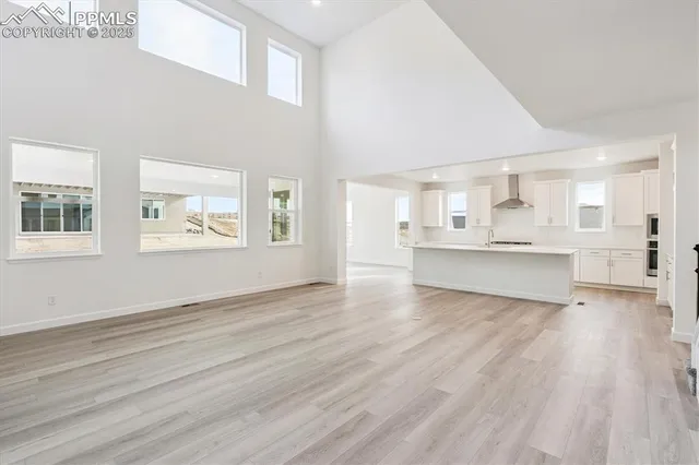 a view of kitchen with wooden floor and windows
