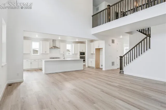 a kitchen with stainless steel appliances granite countertop a sink and cabinets