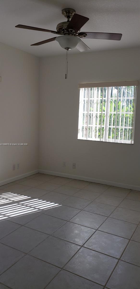 4950 Washington Street, Unit 5 Hollywood, FL 33021 - Photo 12 of 19 a view of an empty room and a window