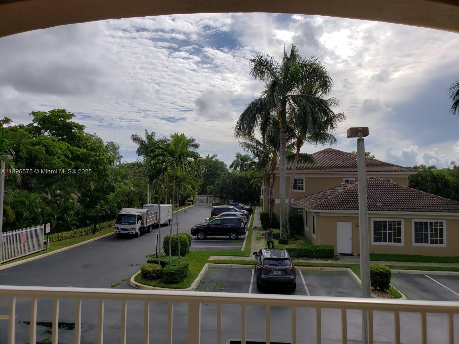 4950 Washington Street, Unit 5 Hollywood, FL 33021 - Photo 3 of 19 a front view of a house with garden