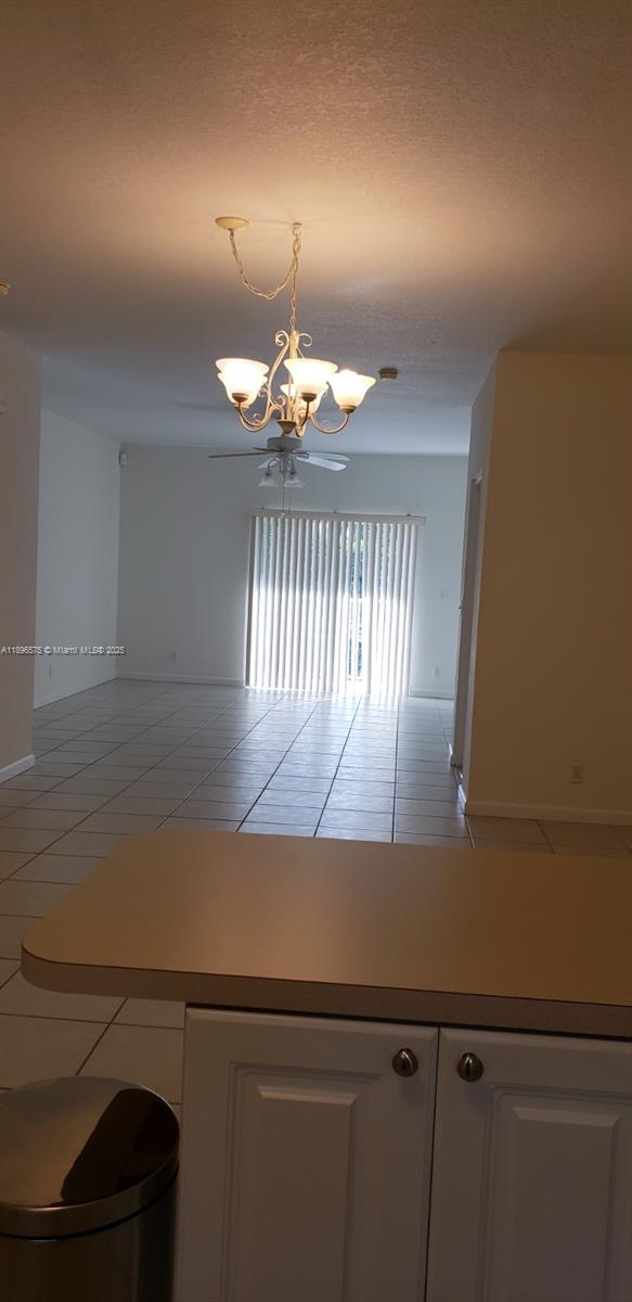 4950 Washington Street, Unit 5 Hollywood, FL 33021 - Photo 10 of 19 an view of a livingroom with a chandelier