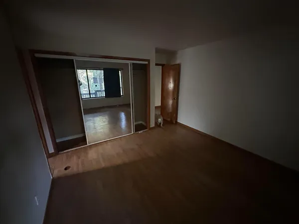 a bathroom with a mirror and tub