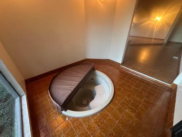 a bathroom with a bathtub and a toilet