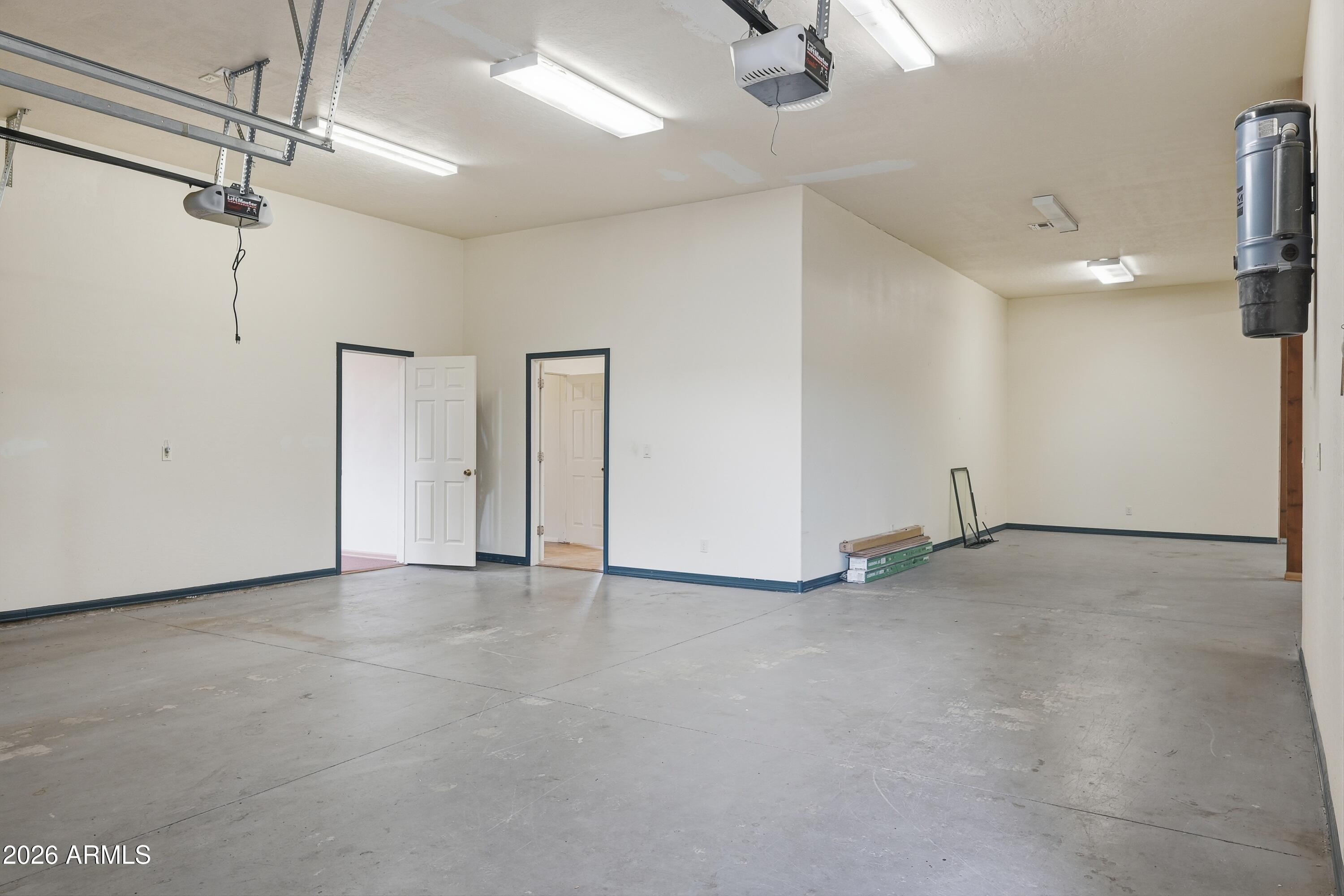 1561 South Canyon Ridge Trail Show Low, AZ 85901 - Photo 37 of 61 an empty room with fan and windows