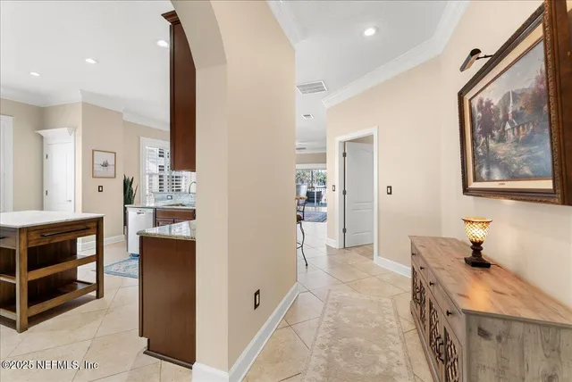 a kitchen with a stove sink and cabinets