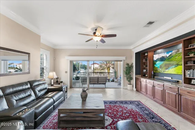 a living room with furniture a rug and a window