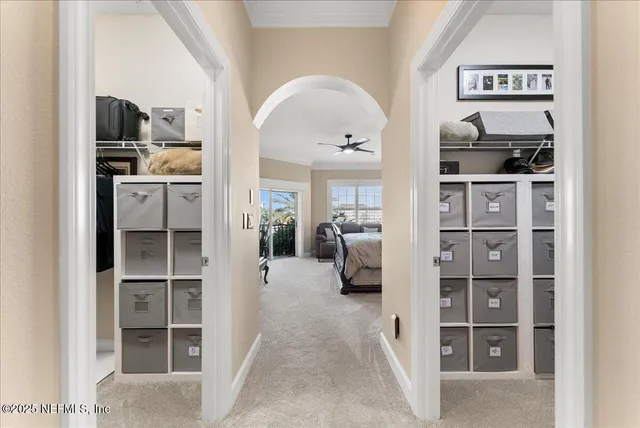 a view of a bedroom with furniture and closet