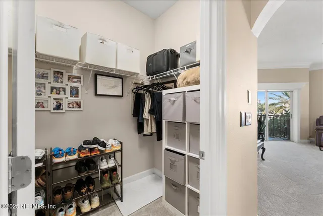 a spacious bathroom with a double vanity sink mirror and bathtub