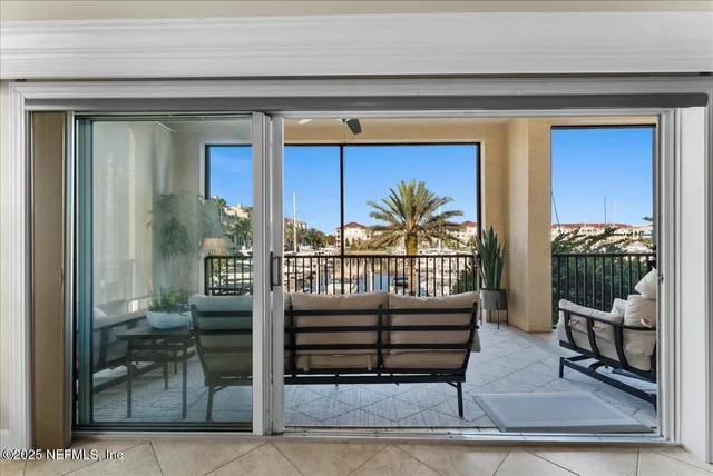 a living room with furniture and a pool table
