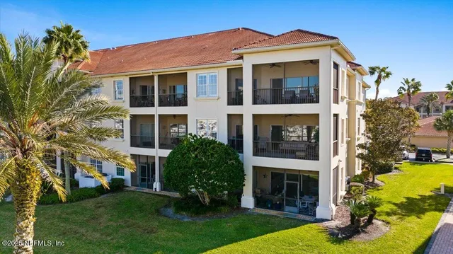 an aerial view of a house with a swimming pool