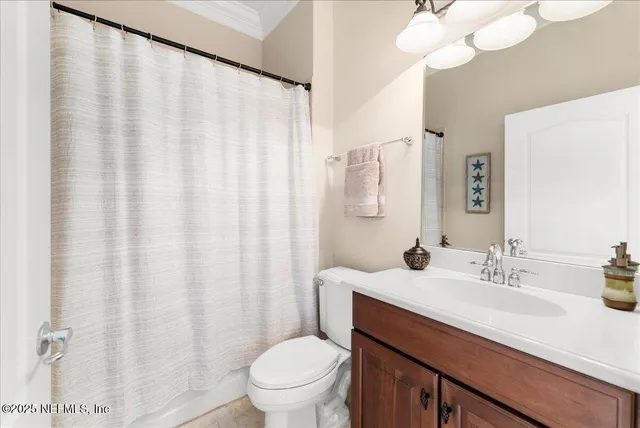 a bed room with a bed and a window