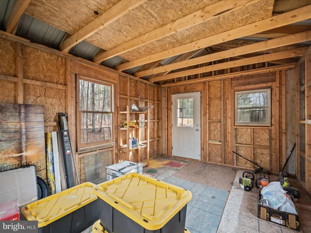 a view of a dry yard with mountains in the background
