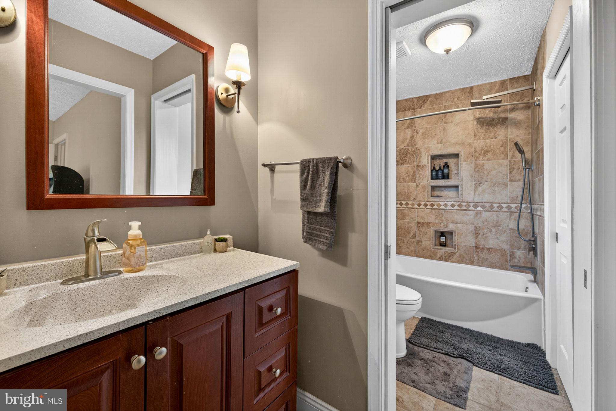 63 Rutherford Circle Sterling, VA 20165 - Photo 32 of 52 Updated shared Bath between BR#3 & BR#4