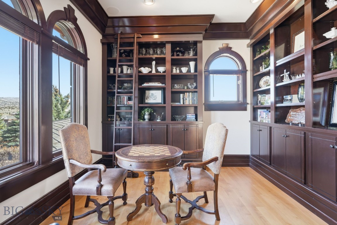 1240 Twin River Cutoff Road Manhattan, MT 59741 - Photo 33 of 88 Fairytale-like library with rich wood built-ins and ladder