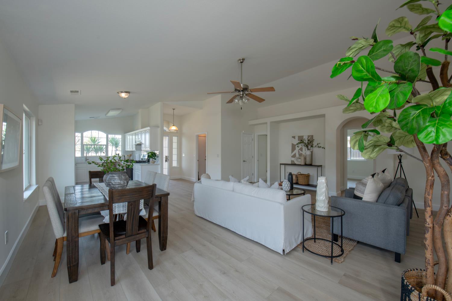 440 Pine Street Parlier, CA 93648 - Photo 11 of 27 a view of a dining room with furniture and wooden floor