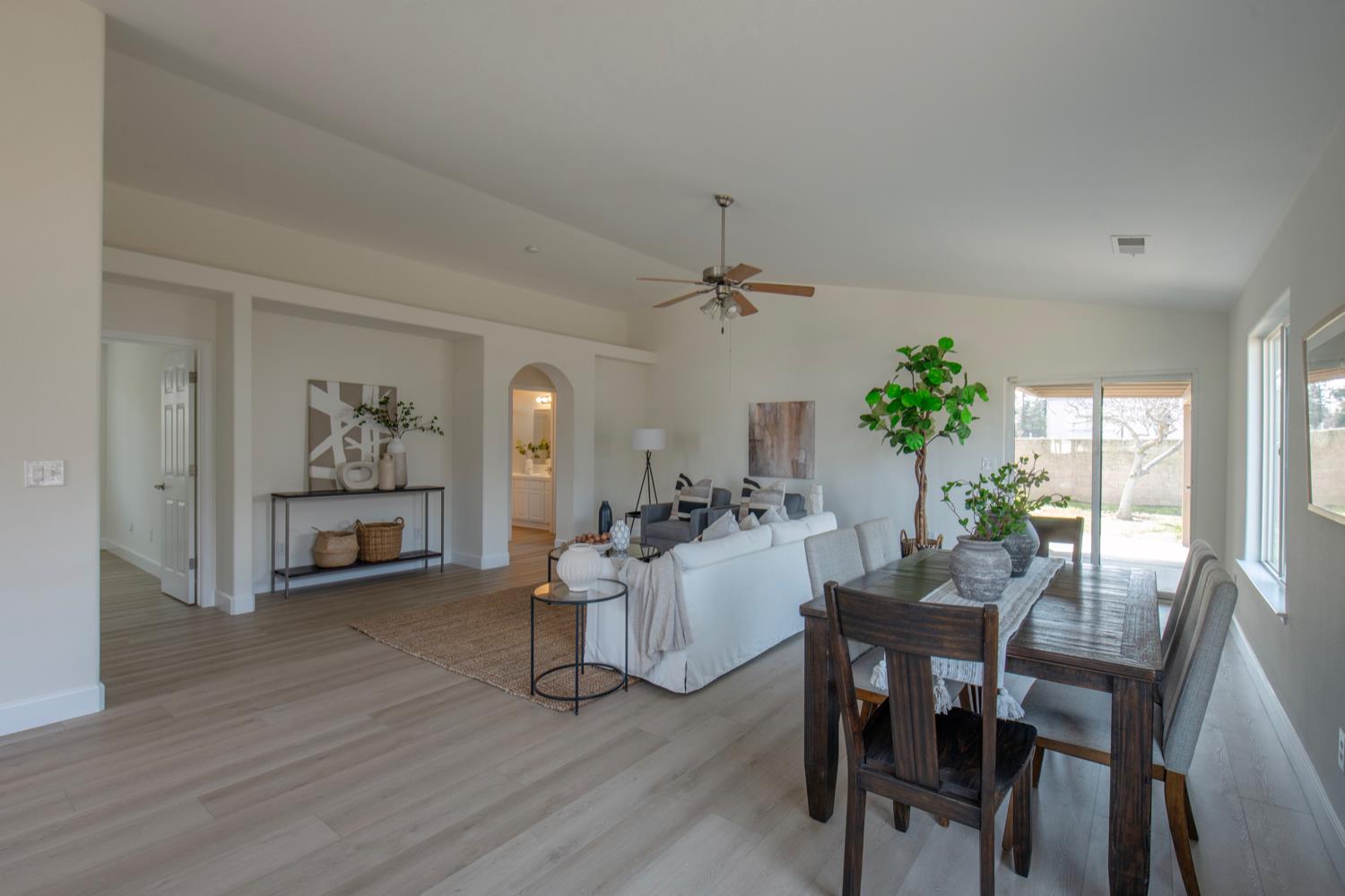 440 Pine Street Parlier, CA 93648 - Photo 12 of 27 a view of a dining room with furniture window and wooden floor