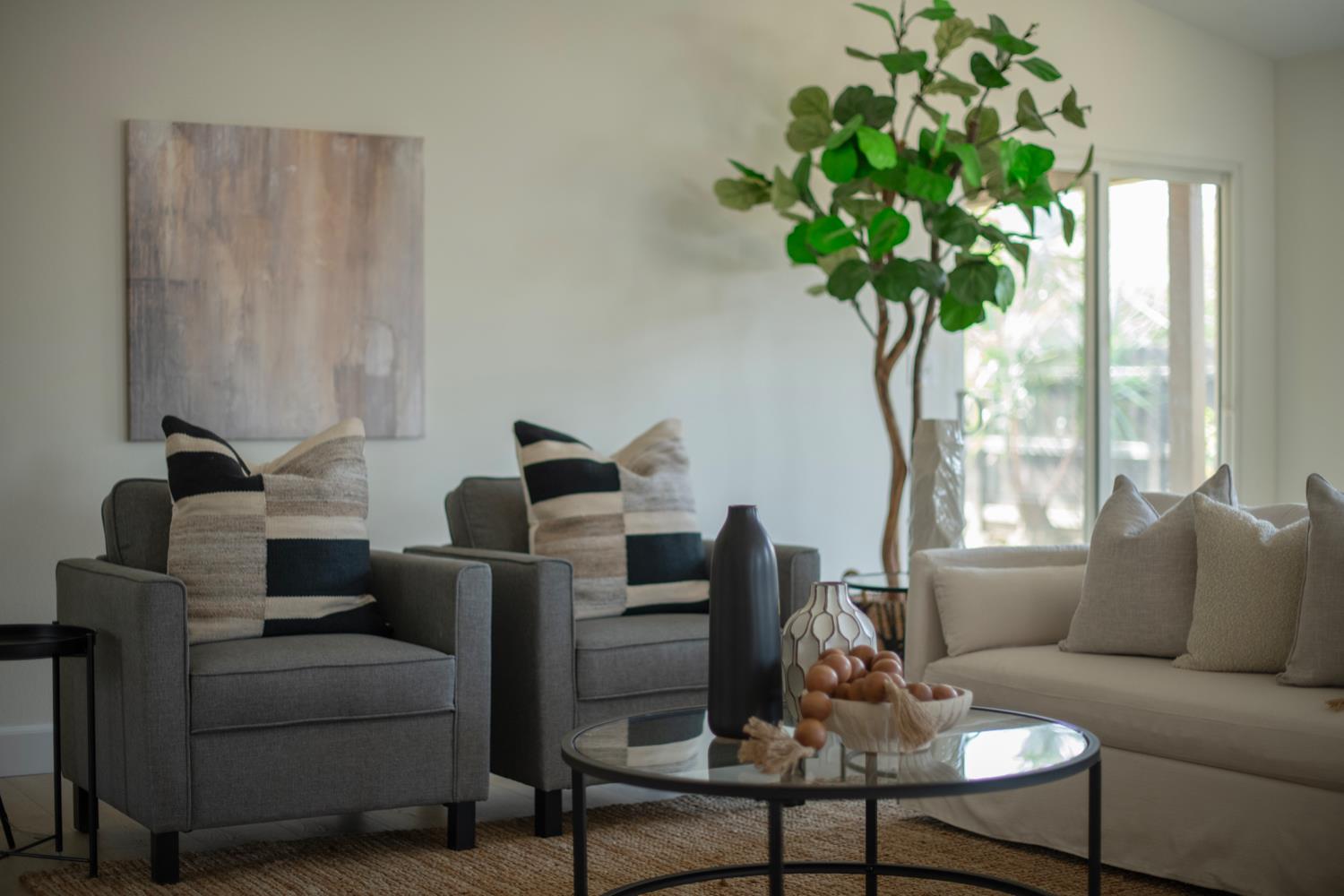 440 Pine Street Parlier, CA 93648 - Photo 15 of 27 a living room with furniture plant and a window