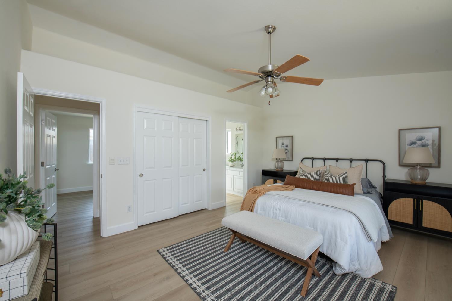 440 Pine Street Parlier, CA 93648 - Photo 20 of 27 a bedroom with a bed and wooden floor