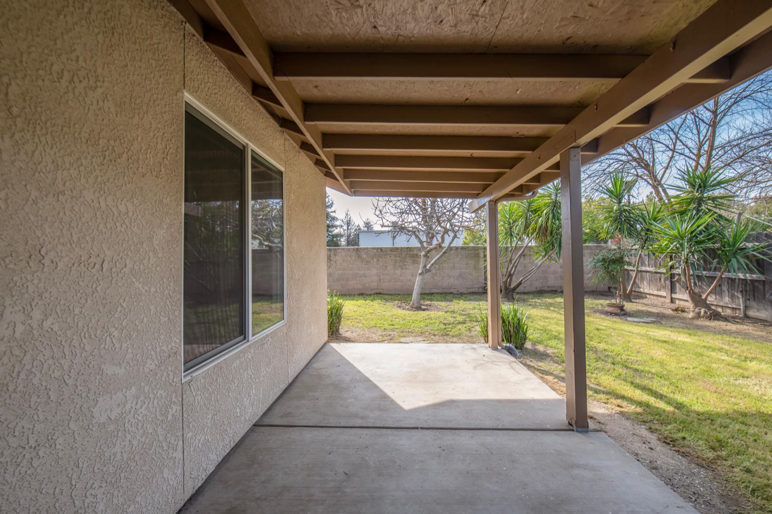 440 Pine Street Parlier, CA 93648 - Photo 24 of 27 a house with swimming pool in front of it