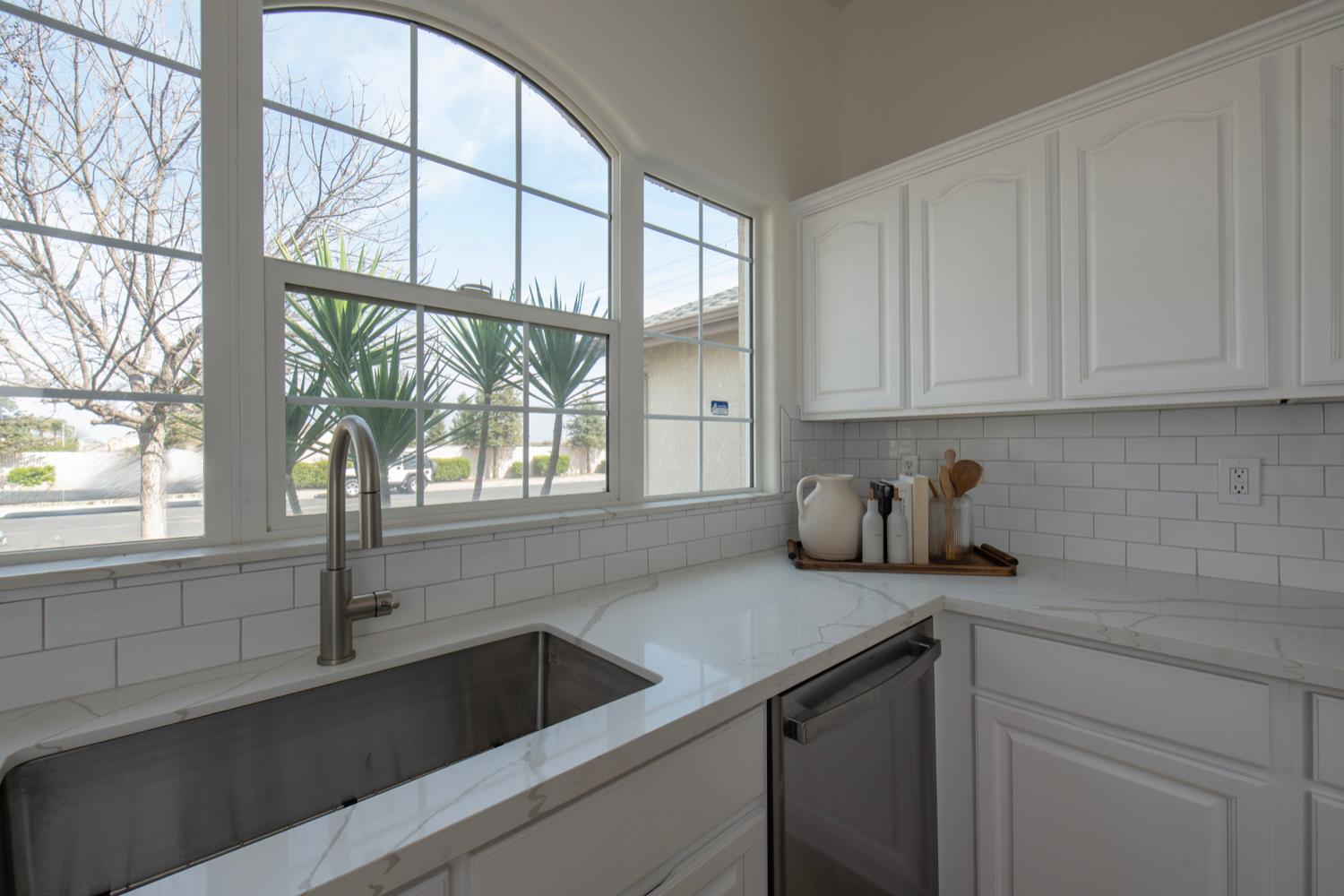 440 Pine Street Parlier, CA 93648 - Photo 8 of 27 a kitchen with a sink a refrigerator and window