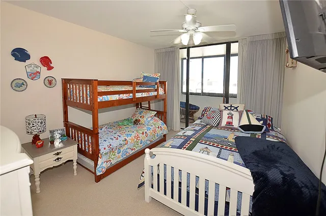 a bathroom with a toilet a sink a mirror and a shower