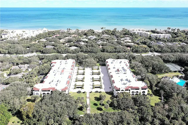 a view of a big yard and a mountain view