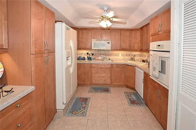 a kitchen with cabinets and stainless steel appliances