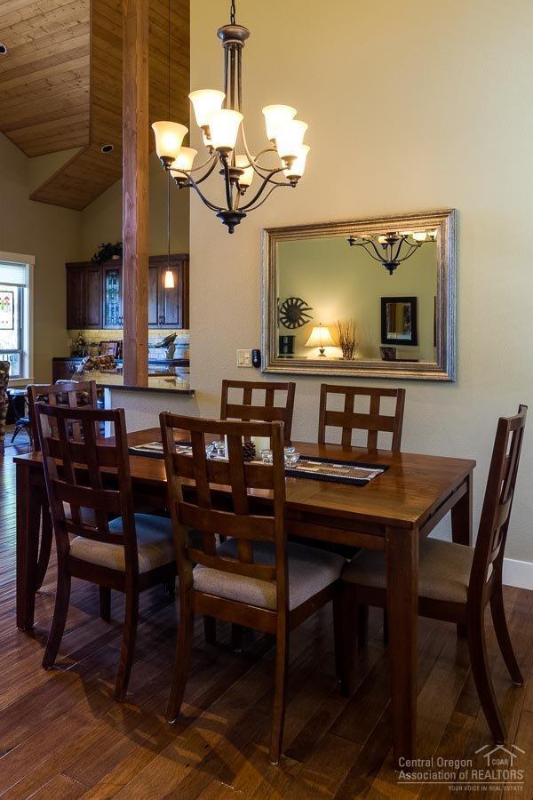 22 Oregon Loop Sunriver, OR 97707 - Photo 7 of 25 a view of a dining room with furniture and chandelier